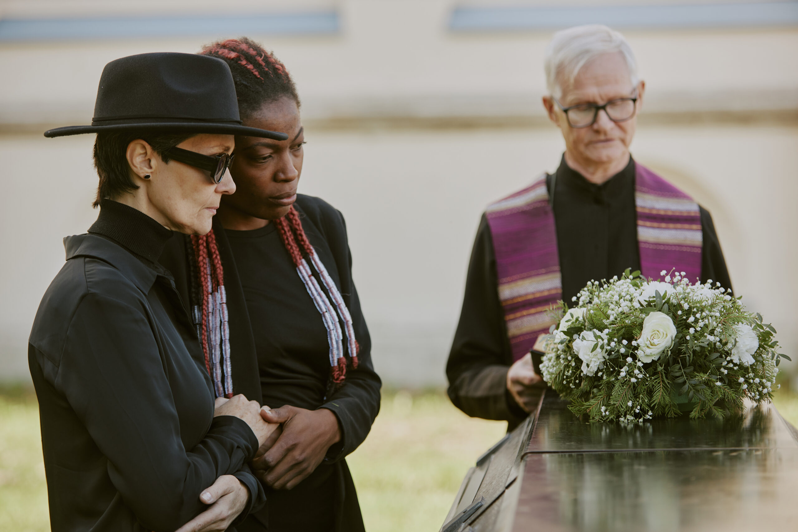 Mom and Daughter Crying at Cemetery