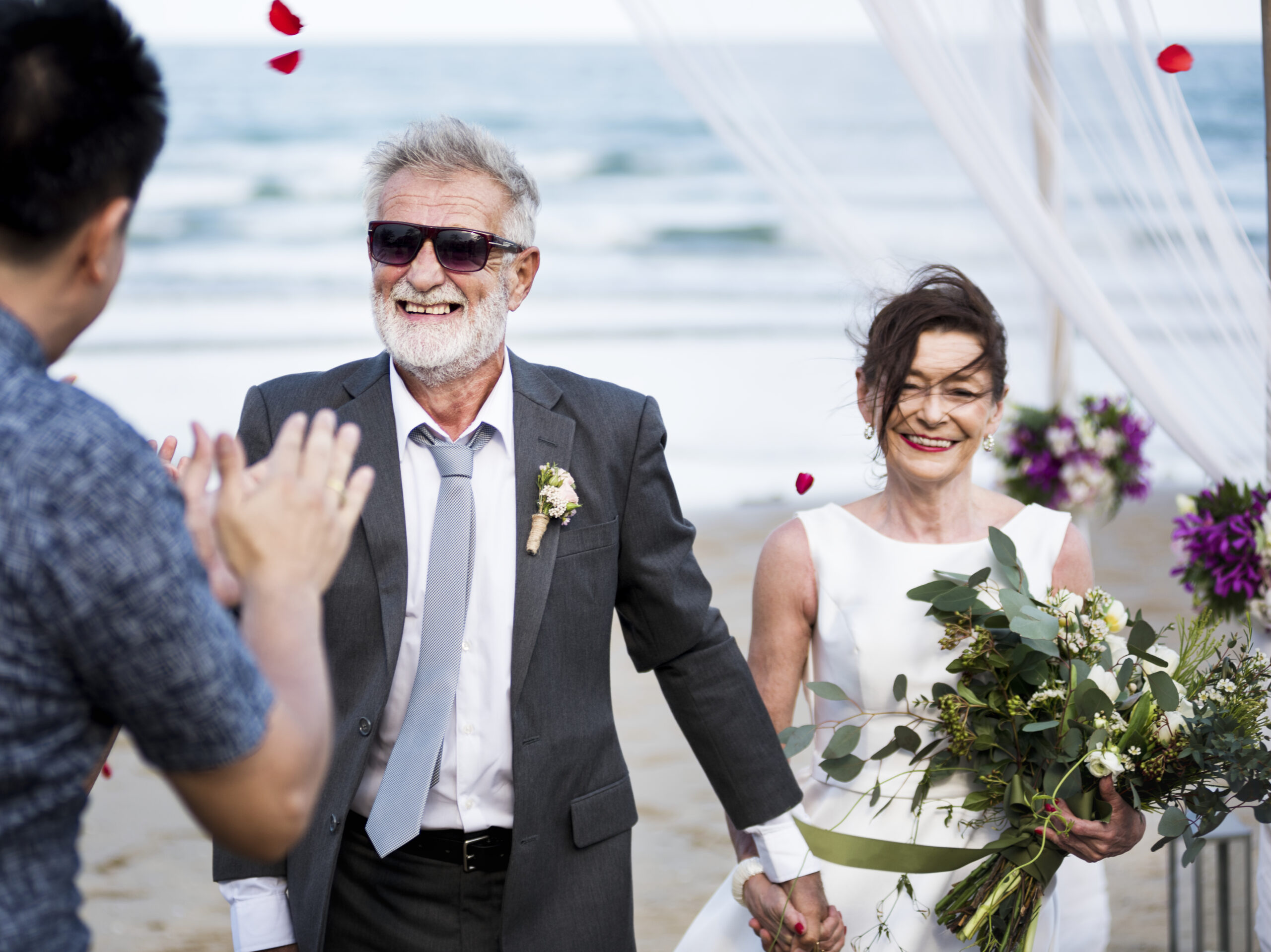 Senior couple getting married at the beach